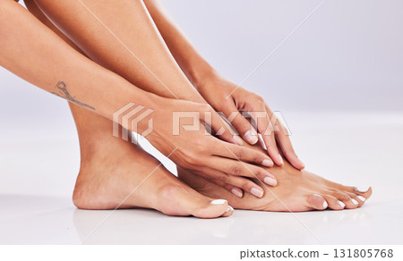 Closeup, skincare and legs with beauty, dermatology and wellness against a studio background. Feet, female and woman with hair removal, salon treatment and luxury with grooming, smooth and soft skin Closeup, skincare and legs with beauty, dermatology and wellness against a studio background. Feet, female and woman with hair removal, salon treatment and luxury with grooming, smooth and soft skin 131805768