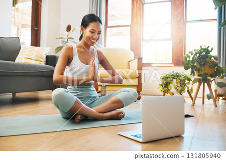 Yoga, meditation and namaste of woman on laptop online class, video call or webinar in holistic fitness or wellness. Biracial person meditate, praying hands and pilates exercise at home on computer 131805940