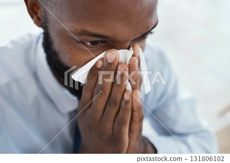 Black man, tissue and blowing nose in business for allergies, sickness and cold virus. Male employee, sick face and sneeze from flu, allergy and health symptoms of sinus, disease and medical risk Black man, tissue and blowing nose in business for allergies, sickness and cold virus. Male employee, sick face and sneeze from flu, allergy and health symptoms of sinus, disease and medical risk 131806102