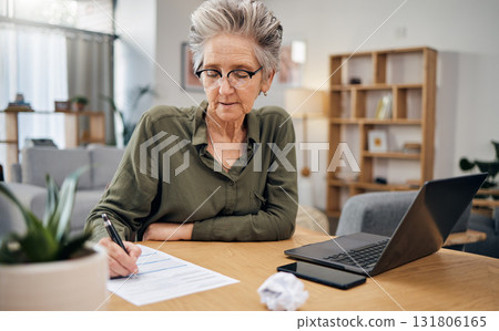Focus, writing and senior woman for asset management, planning and paperwork of financial investment. Insurance, budget ideas or taxes on laptop of boss, executive or entrepreneur in home living room 131806165