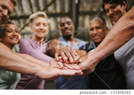 Teamwork, hands together and senior people in gym for motivation, solidarity and team building. Collaboration, group of friends or retired men and women huddle for workout goals and training targets 131806262