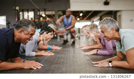 Senior people, fitness and plank with personal trainer in class for workout, core exercise or training at gym. Elderly group in coaching ab session for strong abdominal muscles on gymnasium floor Senior people, fitness and plank with personal trainer in class for workout, core exercise or training at gym. Elderly group in coaching ab session for strong abdominal muscles on gymnasium floor 131806267