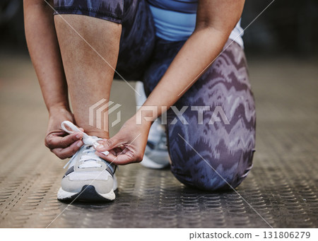 Hands, tie shoes and fitness in gym to start workout, training or exercise for wellness. Sports, athlete and woman tying sneakers or footwear laces to get ready for exercising or running for health. 131806279