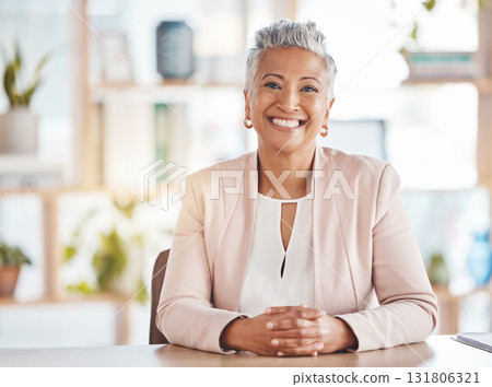 Leadership, portrait and business woman in her office sitting at a desk of a corporate company. Happy, career and face of confident professional senior female executive ceo with a smile in workplace. 131806321