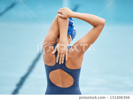 Fitness, training and stretching with woman at swimming pool for health, workout and water sports. Wellness, relax and polo with arm warm up of girl athlete for cardio and exercise or swimmer goals Fitness, training and stretching with woman at swimming pool for health, workout and water sports. Wellness, relax and polo with arm warm up of girl athlete for cardio and exercise or swimmer goals 131806366