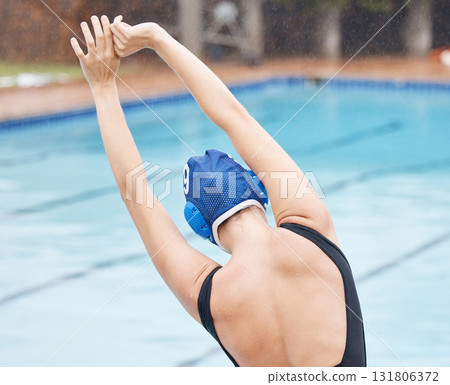 Water polo, training and stretching with woman at swimming pool for health, workout and fitness. Wellness, relax and sports with arm warm up of girl athlete for cardio, endurance and exercise goals 131806372