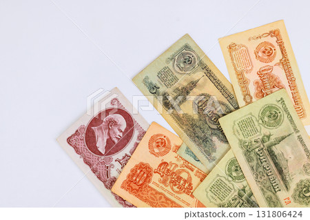 Collection of old money of USSR banknotes displaying intricate designs historical figures, rich history of currency. 131806424