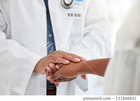 Healthcare, hands and doctor comforting a patient after a diagnosis at a consultation in the hospital. Wellness, compassion and male medical worker with empathy for a woman in a medicare clinic. 131806601