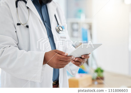 Black man, doctor and hands with tablet in healthcare research, planning or checking schedule appointment at hospital. Hand of African male medical expert working, browsing or search on touchscreen Black man, doctor and hands with tablet in healthcare research, planning or checking schedule appointment at hospital. Hand of African male medical expert working, browsing or search on touchscreen 131806603