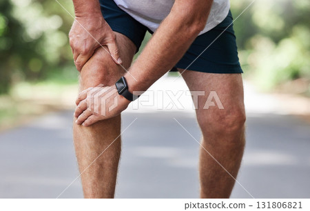 Running, knee pain and old man with hand on leg in park in for outdoor fitness and workout exercise. Health, wellness and muscle strain, senior runner with injury, hands on ache in support or relief. 131806821
