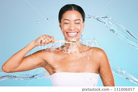 Bamboo toothbrush of black woman isolated on blue background with toothpaste, water splash and dental health. Model or person brushing teeth with eco friendly and sustainable product in studio mockup Bamboo toothbrush of black woman isolated on blue background with toothpaste, water splash and dental health. Model or person brushing teeth with eco friendly and sustainable product in studio mockup 131806857