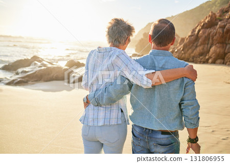 Beach, love and an old couple walking on the sand by the ocean or sea for romance or dating at sunset. Nature, summer or back with a mature woman and man taking a romantic walk together on the coast Beach, love and an old couple walking on the sand by the ocean or sea for romance or dating at sunset. Nature, summer or back with a mature woman and man taking a romantic walk together on the coast 131806955