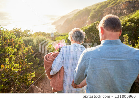 Picnic, romance and senior couple walking in nature with blanket and flowers for love and valentines day. Mountain path, old man and woman holding hands on walk for romantic valentine date from back. Picnic, romance and senior couple walking in nature with blanket and flowers for love and valentines day. Mountain path, old man and woman holding hands on walk for romantic valentine date from back. 131806966