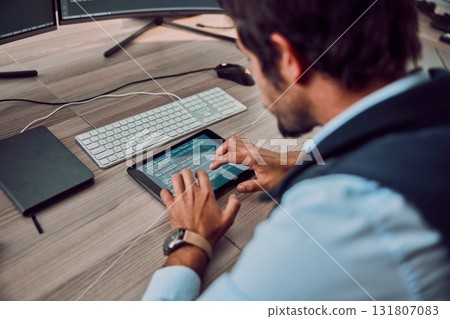 Coding, tablet and man typing with programmer and software update, information technology and code at desk. Cybersecurity, ux and network with wifi, web design and cyber space with cpu programming 131807083