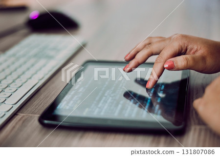 Hands, tablet screen and programmer typing in office, coding or programming on desk. Information technology, female developer and woman with digital touchscreen for software development in workplace. 131807086