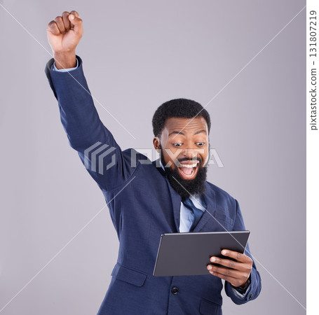 Winner black man on tablet isolated on gray background for stock market, trading and business bonus, fist pump and success. Yes, wow and power of person with winning news or digital profit in studio Winner black man on tablet isolated on gray background for stock market, trading and business bonus, fist pump and success. Yes, wow and power of person with winning news or digital profit in studio 131807219