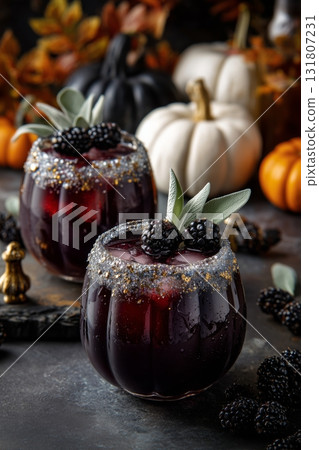 Freshly Made Black Raspberry Drinks Served in Festive Glasses With Autumn Decorations Freshly Made Black Raspberry Drinks Served in Festive Glasses With Autumn Decorations 131807231