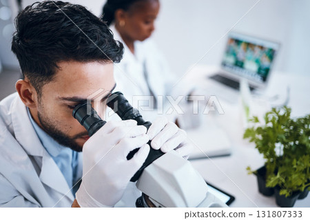 Science, research and male scientist with a microscope for an analysis, test or experiment in medical lab. Innovation, biotechnology and man pharmaceutical researcher or expert working in laboratory. 131807333