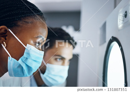 Science, researchers and incubator for experiment, healthcare and medical breakthrough in laboratory. Scientist, glass and employees with masks, innovation and test sample storage for data analysis 131807351