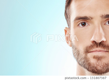 Man, face and skincare for clean hygiene or grooming isolated against blue studio background. Portrait of male model head in facial cosmetics, beauty or spa treatment for self love or care on mockup Man, face and skincare for clean hygiene or grooming isolated against blue studio background. Portrait of male model head in facial cosmetics, beauty or spa treatment for self love or care on mockup 131807387
