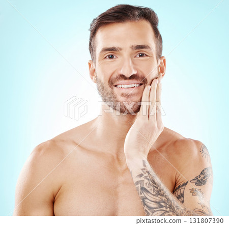 Face, portrait and skincare of man in studio isolated on a blue background. Beauty wellness, dermatology cosmetics or male model happy after spa facial treatment for healthy, glowing or flawless skin Face, portrait and skincare of man in studio isolated on a blue background. Beauty wellness, dermatology cosmetics or male model happy after spa facial treatment for healthy, glowing or flawless skin 131807390