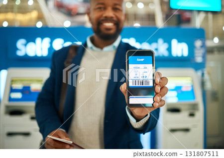 Airport, travel and man with a boarding pass on his phone to check in before his flight for a work trip. Technology, professional and African business male with a electronic plane ticket on cellphone 131807511