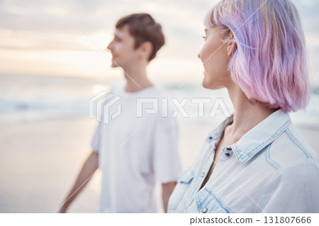Gen z couple, beach walk and sea holiday of students on vacation at sunset. Ocean, walking and relax young people together with love, care and support outdoor feeling calm with blurred background Gen z couple, beach walk and sea holiday of students on vacation at sunset. Ocean, walking and relax young people together with love, care and support outdoor feeling calm with blurred background 131807666