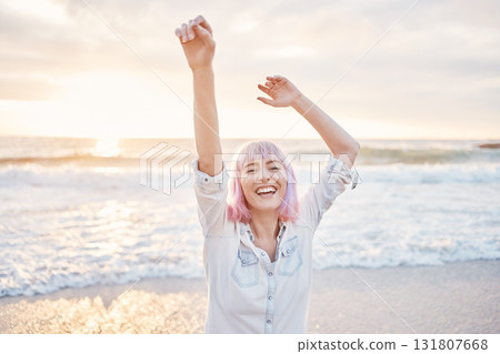 Sunset, beach and portrait of excited woman having fun in waves while on holiday in Indonesia. Smile on face, freedom and travel, happy gen z girl playful on summer ocean vacation with evening dance. Sunset, beach and portrait of excited woman having fun in waves while on holiday in Indonesia. Smile on face, freedom and travel, happy gen z girl playful on summer ocean vacation with evening dance. 131807668