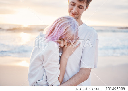 Love, beach and young couple on date for valentines day, ocean fun and romantic embrace at sunset. Romance, happiness and gen z woman and man hug on tropical valentine holiday in Indonesia in evening Love, beach and young couple on date for valentines day, ocean fun and romantic embrace at sunset. Romance, happiness and gen z woman and man hug on tropical valentine holiday in Indonesia in evening 131807669