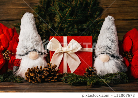 Merry christmas. Christmas composition with gnome and festive decorations on wooden background. Christmas or New Year greeting card. Noel gnome background. Christmas symbol. Happy Holidays. Merry christmas. Christmas composition with gnome and festive decorations on wooden background. Christmas or New Year greeting card. Noel gnome background. Christmas symbol. Happy Holidays. 131807678