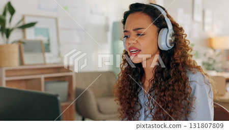 Headphones, laptop and woman on a video call in her office for creative, fashion or artistic career. Start up, small business and female person from Mexico on a virtual conversation for communication Headphones, laptop and woman on a video call in her office for creative, fashion or artistic career. Start up, small business and female person from Mexico on a virtual conversation for communication 131807809
