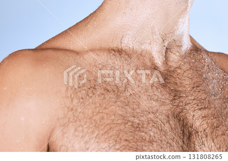 Water drops, wet chest and closeup man in shower for cleaning, care and wellness on background. Beauty, human body and hairy male in studio for washing, grooming and hygiene cosmetics for skincare 131808265