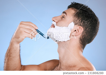 Shaving chin, foam and man with razor, beard maintenance and product placement in studio mock up. Shave cream, face and hair or skincare for male model facial grooming, isolated on blue background. 131808280