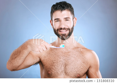 Teeth, toothbrush and portrait of man in studio for dental wellness, healthy smile and mouth care. Happy face, male model and oral cleaning for fresh breath, gums and dentistry on blue background Teeth, toothbrush and portrait of man in studio for dental wellness, healthy smile and mouth care. Happy face, male model and oral cleaning for fresh breath, gums and dentistry on blue background 131808310