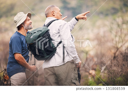 Hiking, pointing and senior men in nature for travel, walking and on a backpack adventure in Spain. Search, view and elderly friends doing bird watching and looking at environment in the mountains Hiking, pointing and senior men in nature for travel, walking and on a backpack adventure in Spain. Search, view and elderly friends doing bird watching and looking at environment in the mountains 131808539