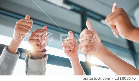 Hands, thumbs up and collaboration with a business team in celebration together at the office from below. Winner, teamwork or gesture with a man and woman employee group celebrating at work closeup Hands, thumbs up and collaboration with a business team in celebration together at the office from below. Winner, teamwork or gesture with a man and woman employee group celebrating at work closeup 131808570