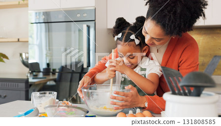 Baking, kitchen and mother with girl learning, helping and bonding for recipe, food and dessert. Happy family, African and mom teaching girl to bake with flour, mix ingredients and cake in home 131808585