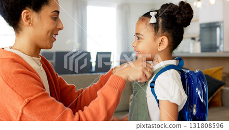 Back to school, mom and helping young girl at home ready for education and class. Kindergarten, mother support and happy child together with backpack and smile in a living room with love and care Back to school, mom and helping young girl at home ready for education and class. Kindergarten, mother support and happy child together with backpack and smile in a living room with love and care 131808596
