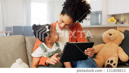 Tablet, sofa and happy mother with child for bonding, healthy relationship and online learning. African family, love and mom with girl on digital tech for streaming video, cartoons and movies in home 131808611