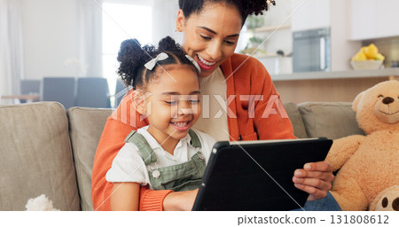 Tablet, sofa and mother with girl in home for bonding, healthy relationship and online learning. African family, happy and mom with child on digital tech for streaming video, cartoons and movies Tablet, sofa and mother with girl in home for bonding, healthy relationship and online learning. African family, happy and mom with child on digital tech for streaming video, cartoons and movies 131808612