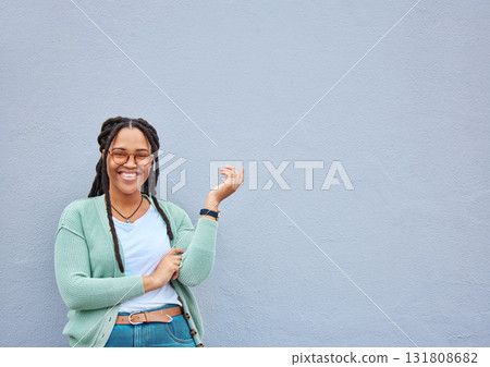 Mockup, portrait and black woman pointing to space for advertising, empty or grey wall background. Face, gesture and girl relax, happy and smile in studio on product placement, isolated or copy space Mockup, portrait and black woman pointing to space for advertising, empty or grey wall background. Face, gesture and girl relax, happy and smile in studio on product placement, isolated or copy space 131808682