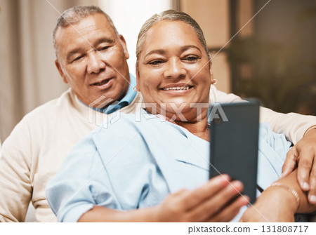 Love, senior couple and selfie in home for happy memory while spending time together. Romance, retirement and smile of elderly and retired man and woman taking pictures or photo for social media. Love, senior couple and selfie in home for happy memory while spending time together. Romance, retirement and smile of elderly and retired man and woman taking pictures or photo for social media. 131808717