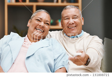 Love, portrait and senior couple watching tv, having fun and laughing at comic movie in living room. Valentines, romance and elderly retired man and woman streaming funny comedy video on television. 131808721