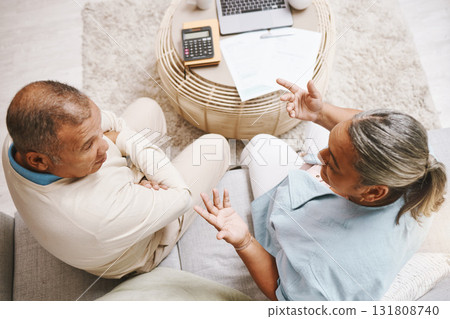 Senior couple, documents and laptop for planning, budget or taxes with discussion for future in top view. Old man, woman and conversation for insurance, will or financial strategy for retirement life Senior couple, documents and laptop for planning, budget or taxes with discussion for future in top view. Old man, woman and conversation for insurance, will or financial strategy for retirement life 131808740