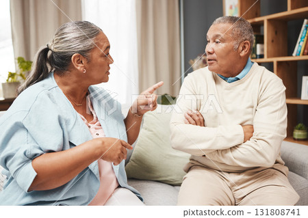 Senior couple, fight and angry on sofa for marriage problems, conflict and communication. Divorce, argument and frustrated partner of man, woman and people in anger, living room and blame of affair 131808741