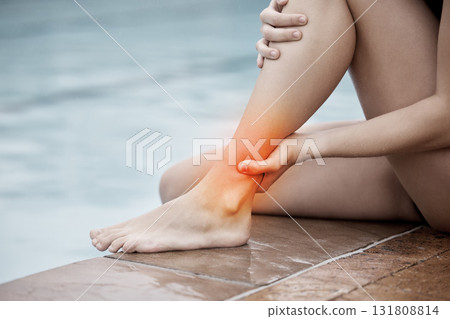 Pool, fitness and athlete with an ankle pain, injury or accident after water sport training or exercise. Sports, swim and woman swimmer with leg sprain, medical emergency or torn muscle after workout 131808814