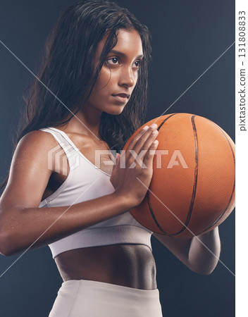 Basketball player, sports exercise and studio woman for wellness challenge, practice game or fitness competition. Health performance, training workout and athlete model isolated on dark background 131808833