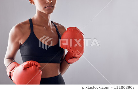 Boxing, gloves and woman on background, mockup and space for sports exercise, strong warrior and mma training. Female boxer, workout and fist fight in studio, energy and power in challenge of mock up Boxing, gloves and woman on background, mockup and space for sports exercise, strong warrior and mma training. Female boxer, workout and fist fight in studio, energy and power in challenge of mock up 131808902