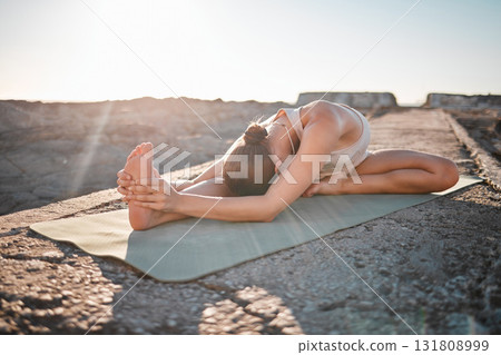 Yoga, wellness and woman stretching body on rock for healthy lifestyle, pilates training and cardio workout. Sports, fitness and girl doing meditation, stretch and exercise for zen, peace and calm 131808999