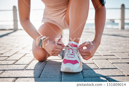 Closeup, fitness and woman tie shoes, training and exercise for wellness, health and performance. Zoom, female athlete and lady with tying shoes, ready for marathon and run for cardio and energy Closeup, fitness and woman tie shoes, training and exercise for wellness, health and performance. Zoom, female athlete and lady with tying shoes, ready for marathon and run for cardio and energy 131809014